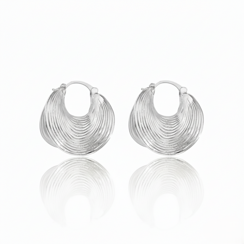 Pair of silver hoop earrings on a white background