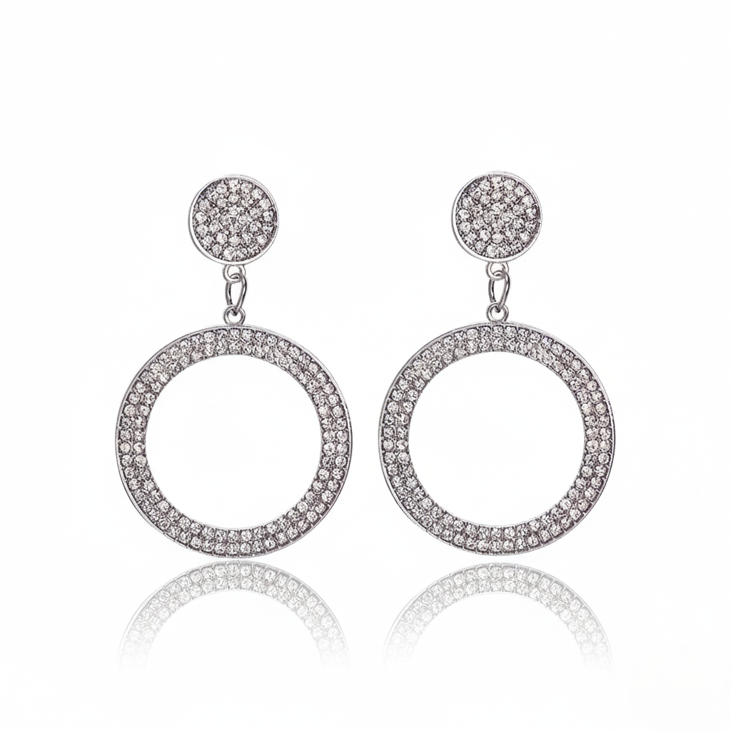 Pair of silver hoop earrings with clear stones on a white background