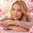 Woman wearing multiple bracelets on a pink floral background