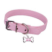 Pink dog collar with a bone-shaped tag featuring a paw print on a white background