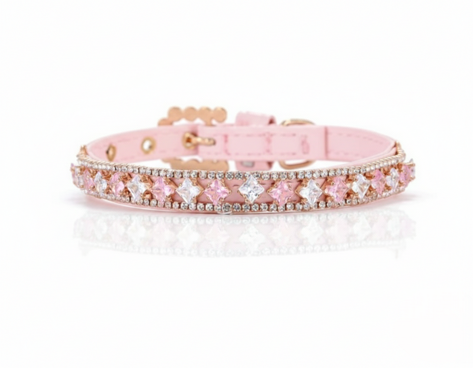 Pink dog collar with decorative elements on a white background