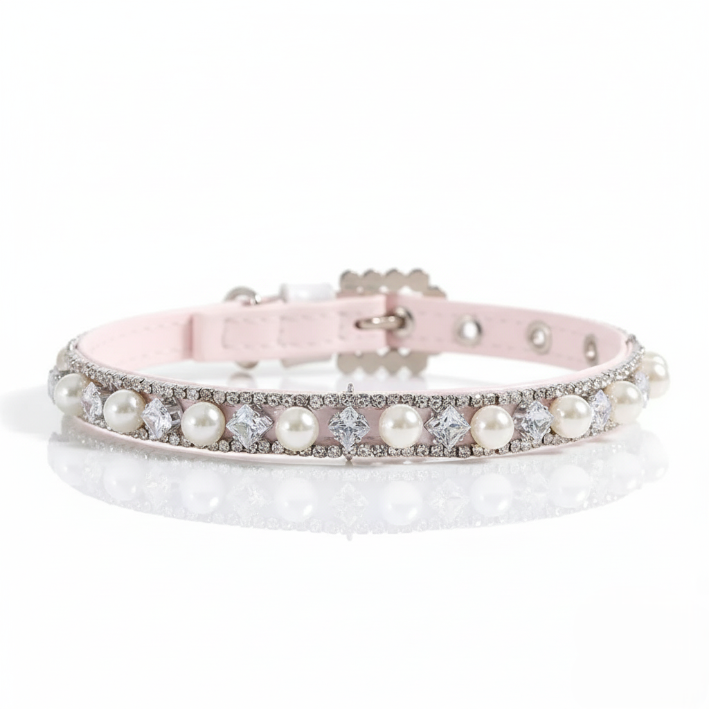 Pink dog collar with pearls and crystals on a white background