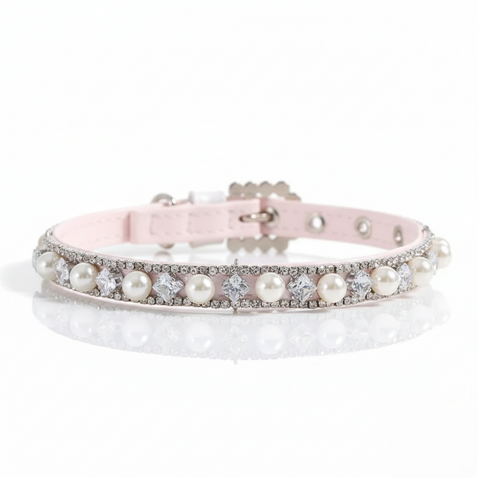 Pink dog collar with pearls and crystals on a white background