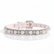 Pink dog collar with pearls and crystals on a white background
