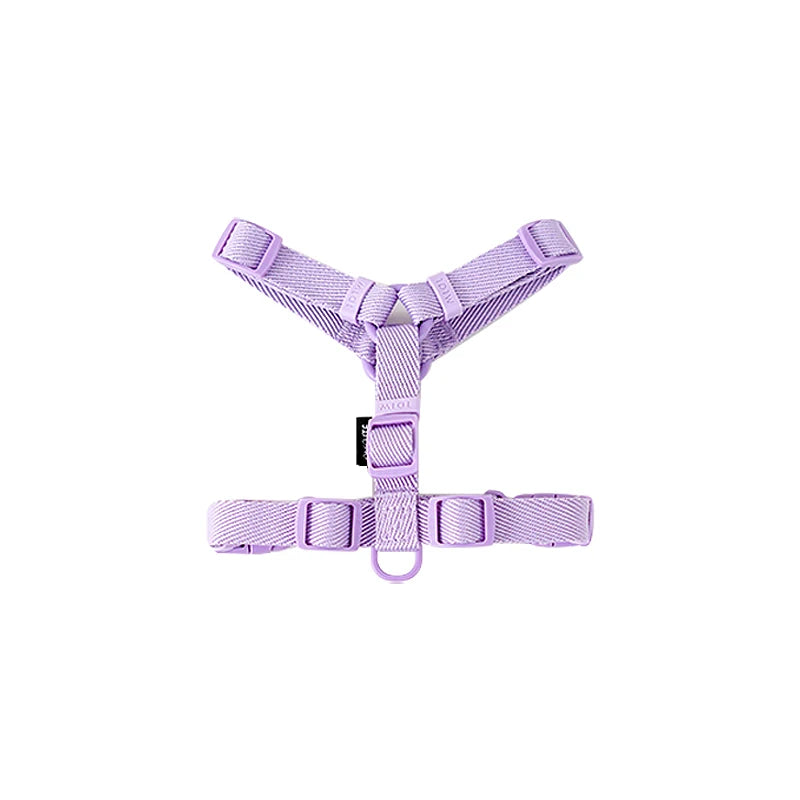 Purple dog harness on a white background