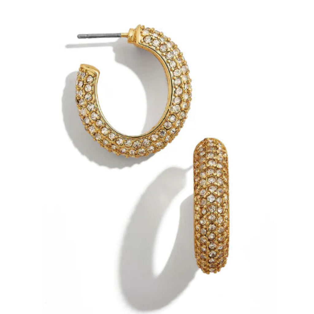 Gold hoop earrings with clear gemstones on a white background