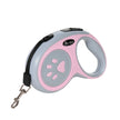 Retractable dog leash with pink and gray design on a white background