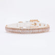 Rose gold collar with clear stones on a white background
