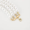 Pearl necklace with a gold clasp on a white background