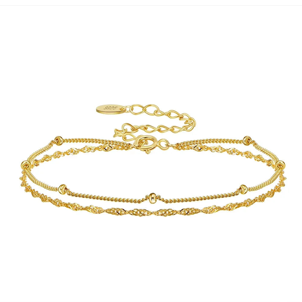 Gold bracelets with a clasp on a white background, featuring a 'Sterling 925' stamp.