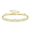 Gold bracelets with a clasp on a white background, featuring a 'Sterling 925' stamp.