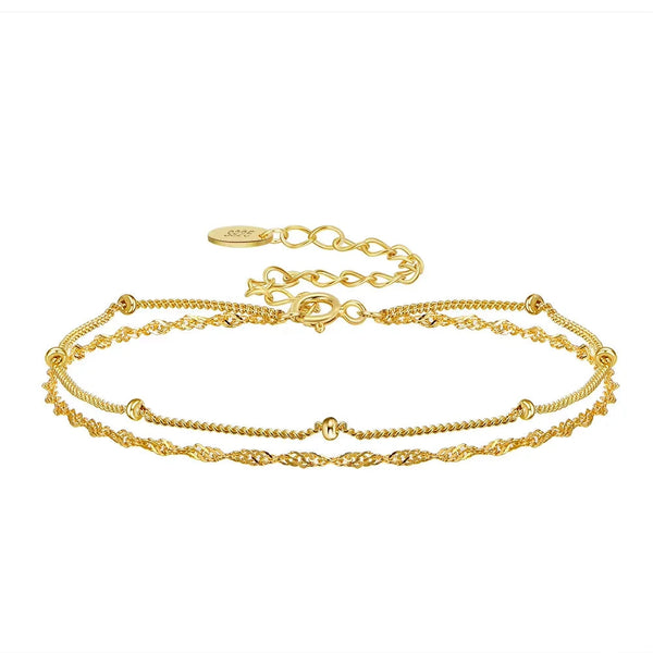 Gold bracelets with a clasp on a white background, featuring a 'Sterling 925' stamp.