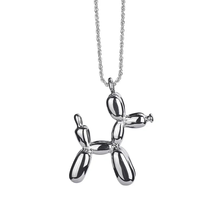 Silver balloon dog pendant on a chain against a white background