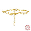 Gold bracelet with a tag and 'Real Sterling Silver' stamp on a white background, featuring Orsa Jewels brand.