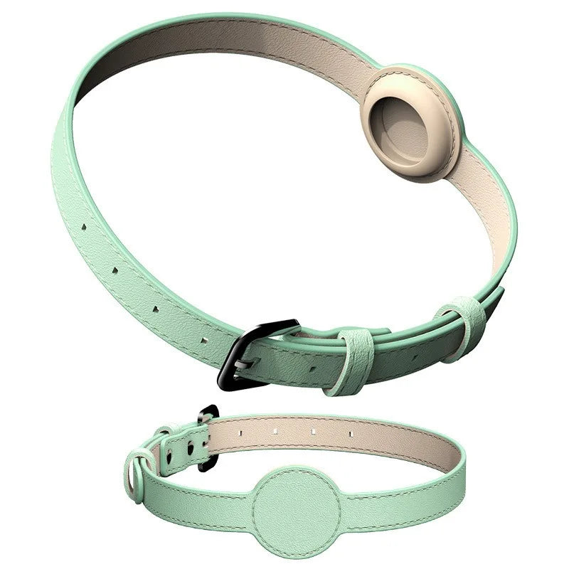 green dog collars with circular tags on a white background