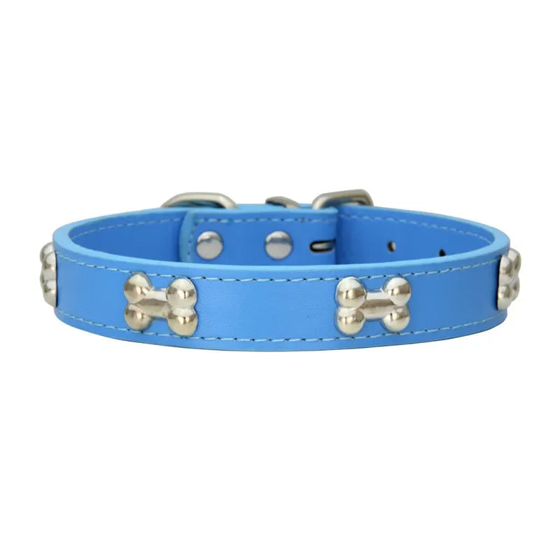 Blue dog collar with bone-shaped studs on a white background