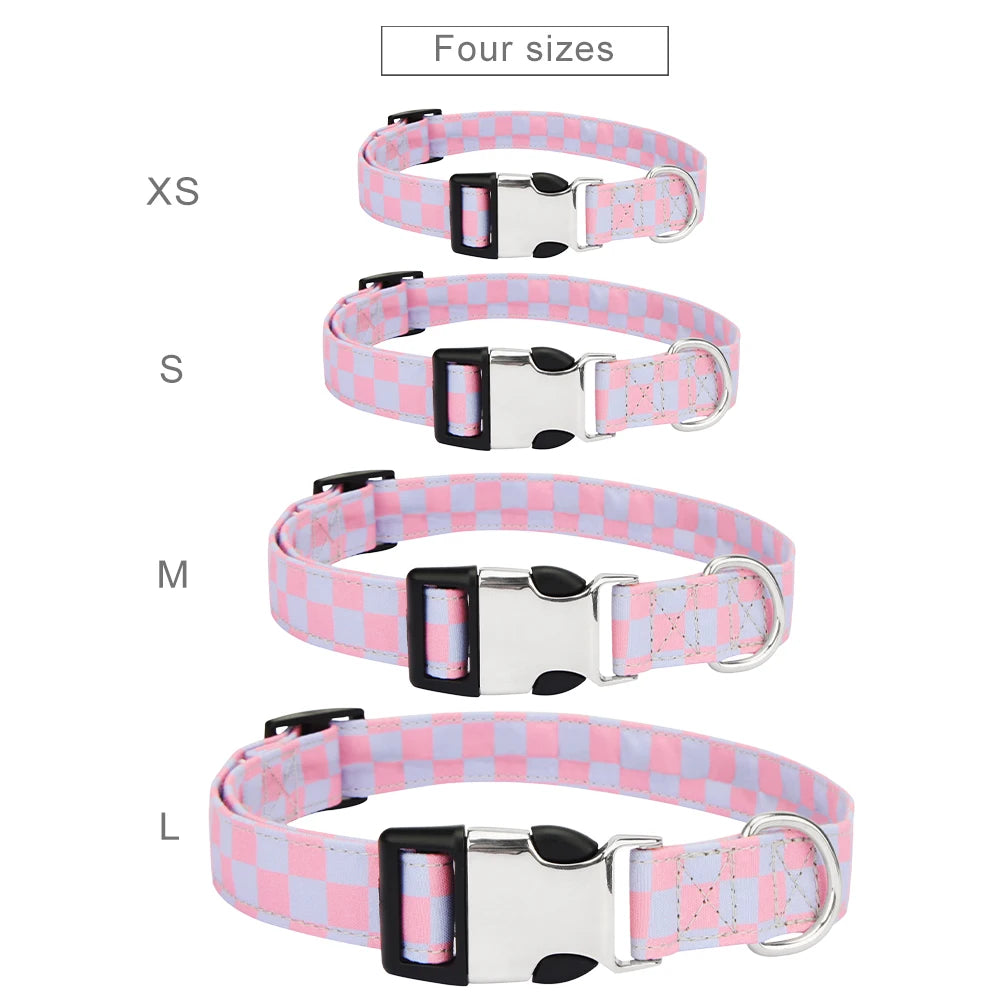 Set of four dog collars in different sizes with a pink and blue checkered pattern.