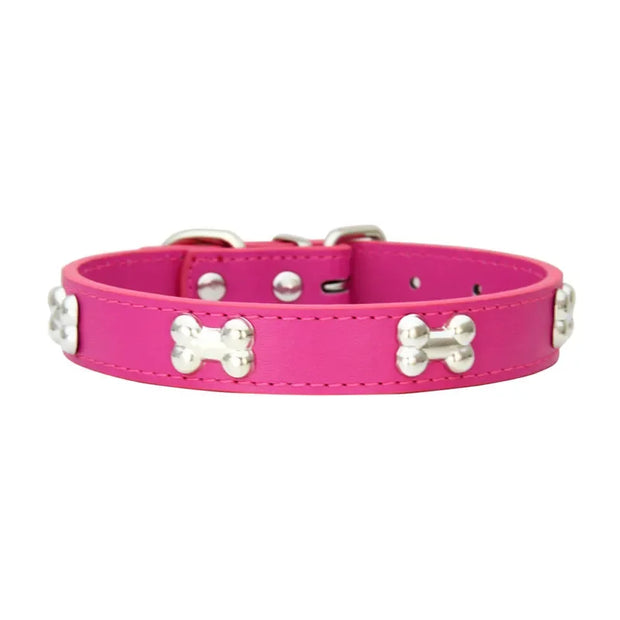 Pink dog collar with silver bone-shaped studs on a white background