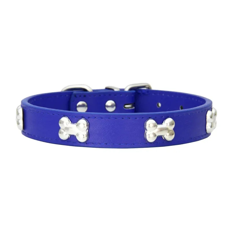 Navy Blue dog collar with silver bone-shaped studs on a white background