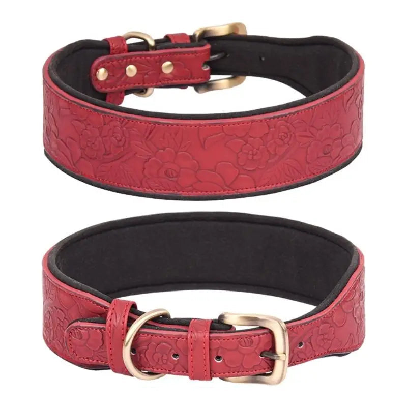 Red leather dog collar with floral embossing and gold hardware on a white background