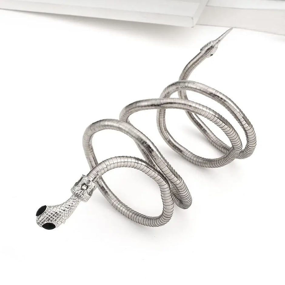 Silver coiled cable with a decorative end on a white background