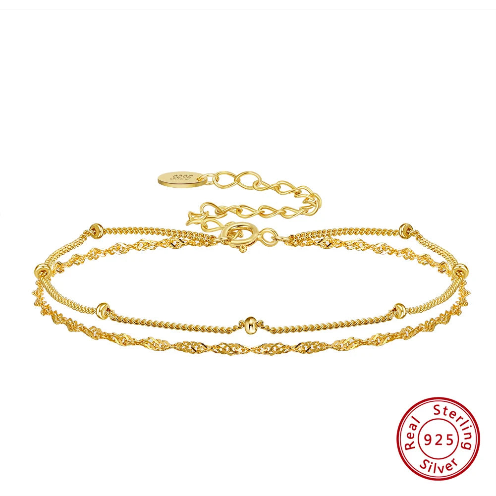 Gold bracelet with a visible 'Sterling 925' stamp on a white background