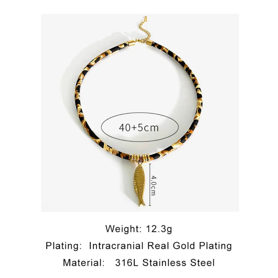 Necklace with gold plating and feather pendant on a white background