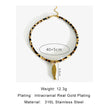 Necklace with gold plating and feather pendant on a white background
