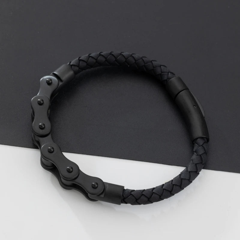 Black braided bracelet on a dark gray background