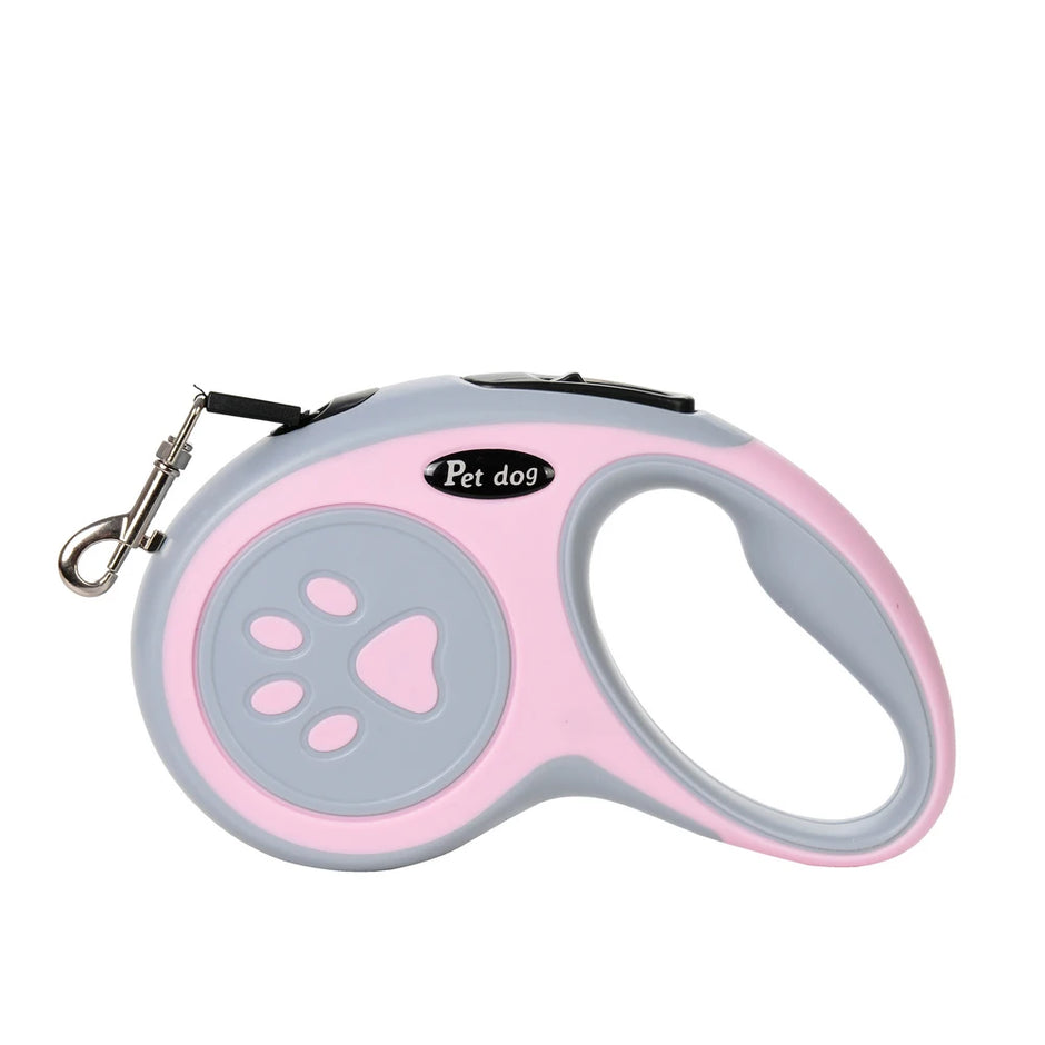 Pink and gray retractable dog leash with paw design on a white background