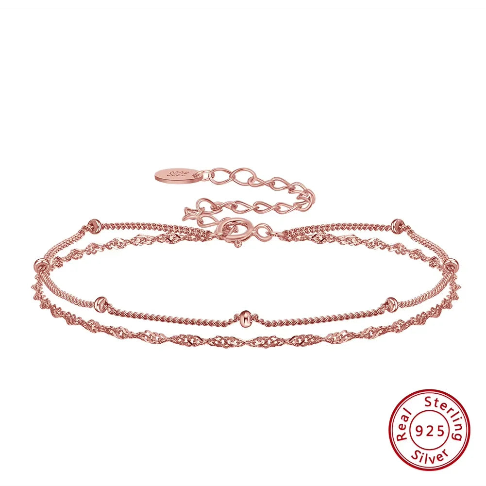 Rose gold chain bracelet with a visible 'Sterling 925' stamp on a white background