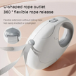 White pet leash holder with U-shaped rope outlet and flexible rope release on a beige background