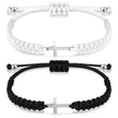 Two bracelets: one silver with a cross charm and braided design, the other black cord with a similar cross charm.