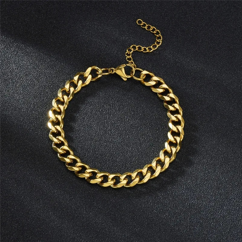 Gold chain bracelet on a black background
