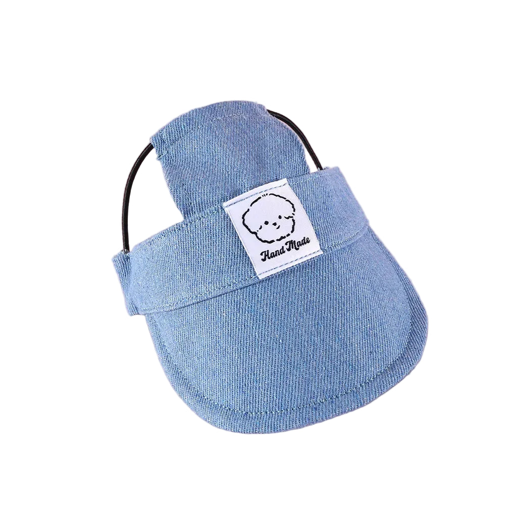 Blue pet carrier with a label on a pink background