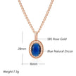 Rose gold necklace with blue natural zircon pendant on a white background