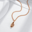Rose gold necklace with a shell pendant on a white background