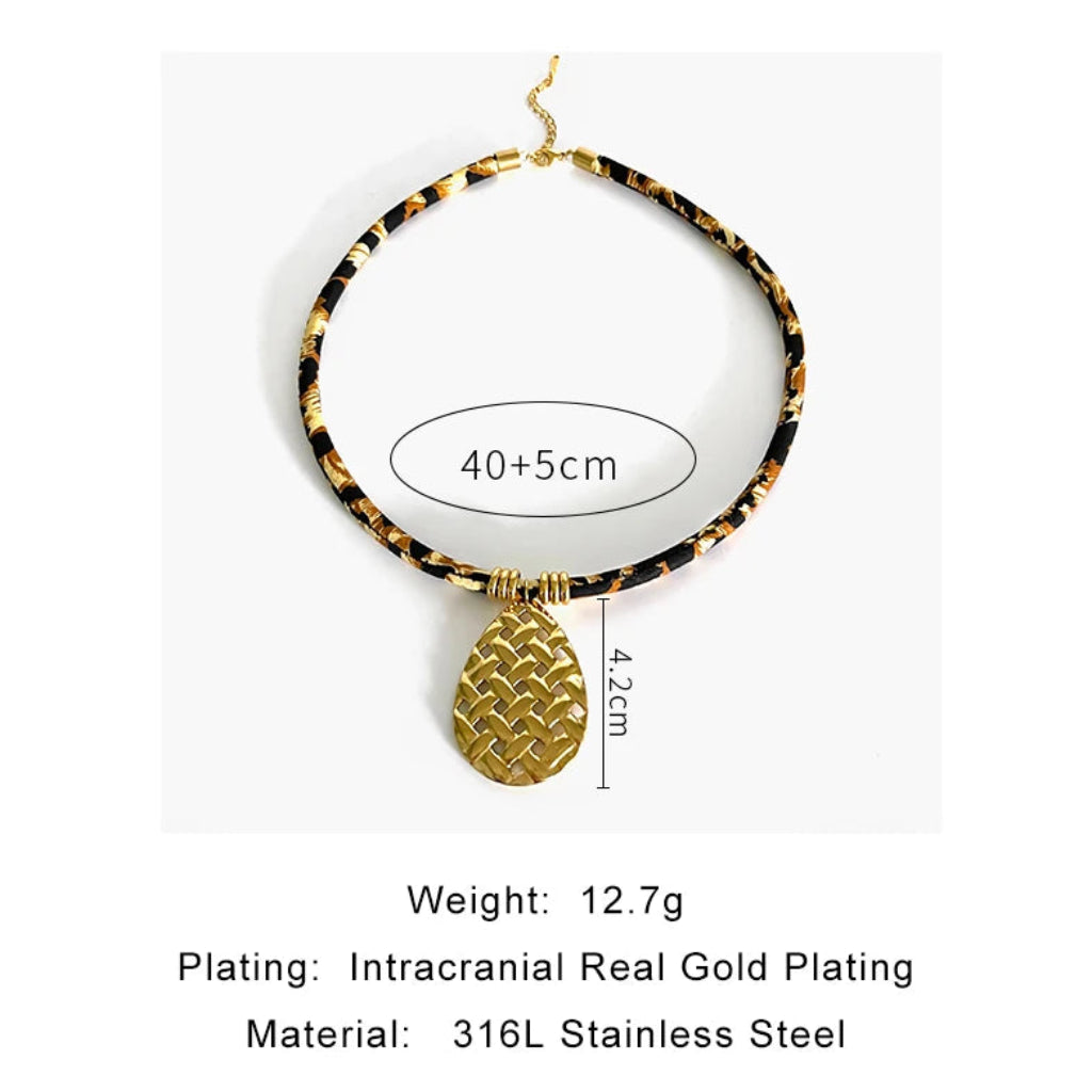 Necklace with gold pineapple pendant and measurement details on a white background