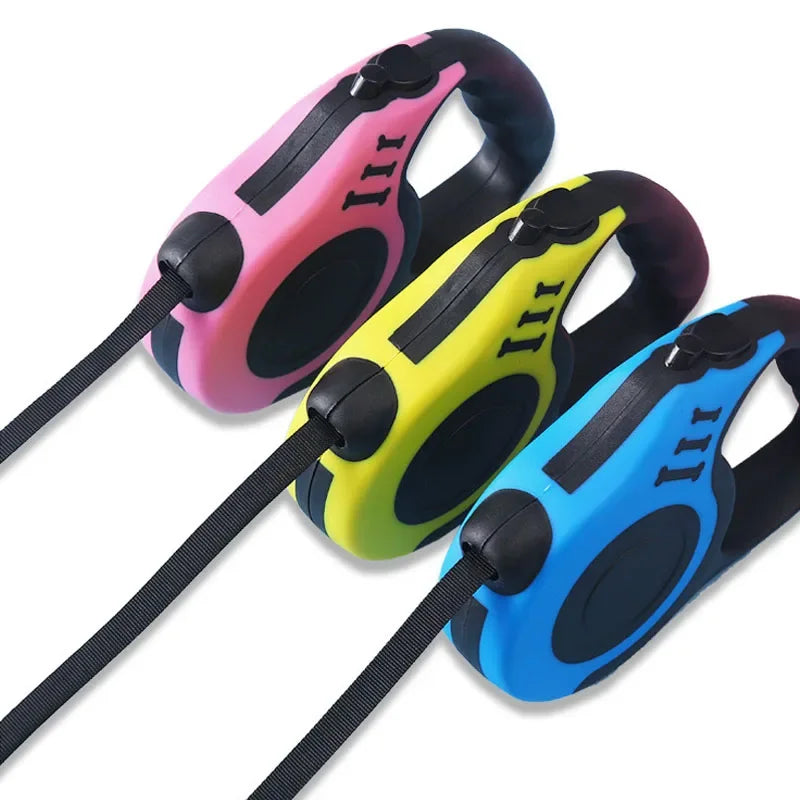 Three colorful dog leashes with black handles on a white background