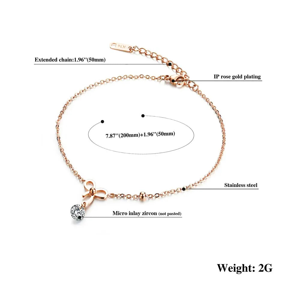 Rose gold bracelet with zirconia charm on a white background