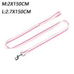 Pink and yellow striped dog leash with metal clip on a white background