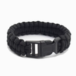Black paracord bracelet with a black buckle on a white background