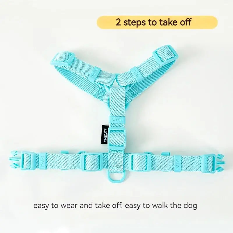 Light blue dog harness with text indicating ease of wear and removal on a white background