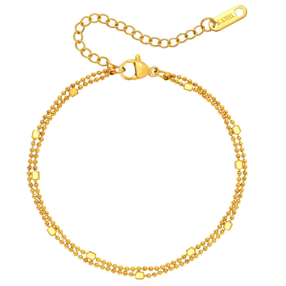 Gold bracelet with a clasp on a white background