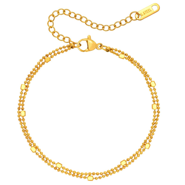 Gold bracelet with a clasp on a white background