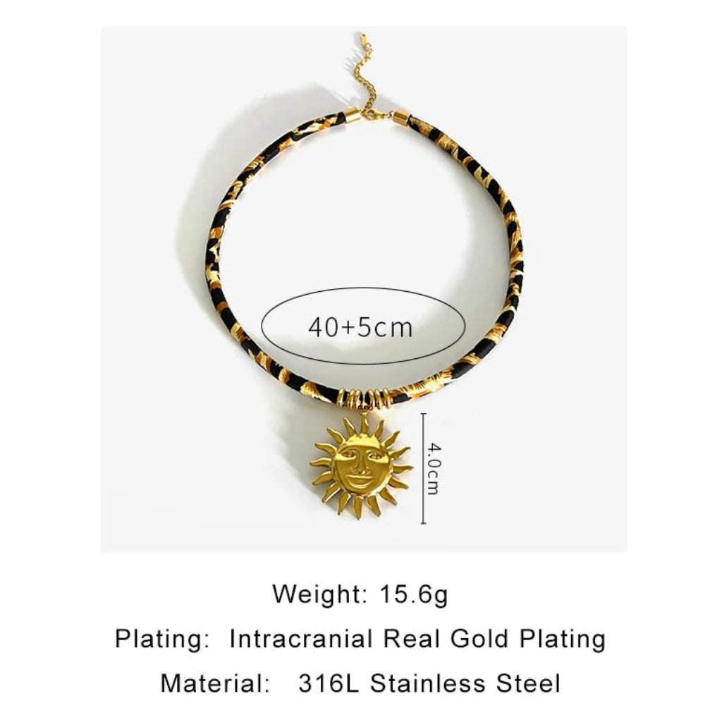 Necklace with gold plating and sun pendant on a white background
