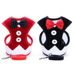 Two dog harnesses, one red and black, the other black and red, with leashes on a white background.