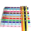 Set of colorful dog collars with bone-shaped metal buckles on a white background