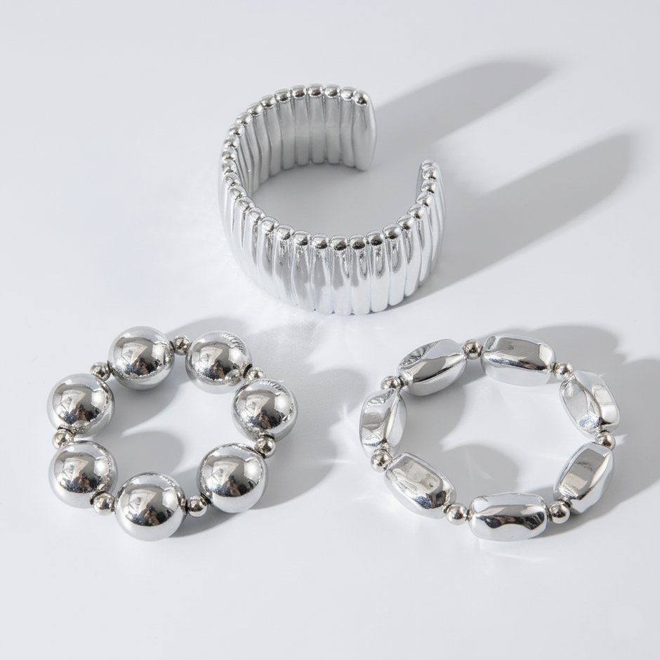 Three silver rings on a white background