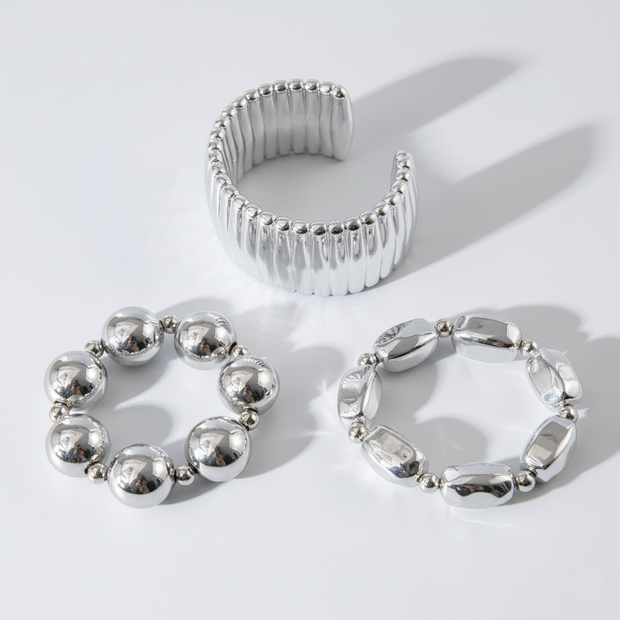 Three silver rings on a white background